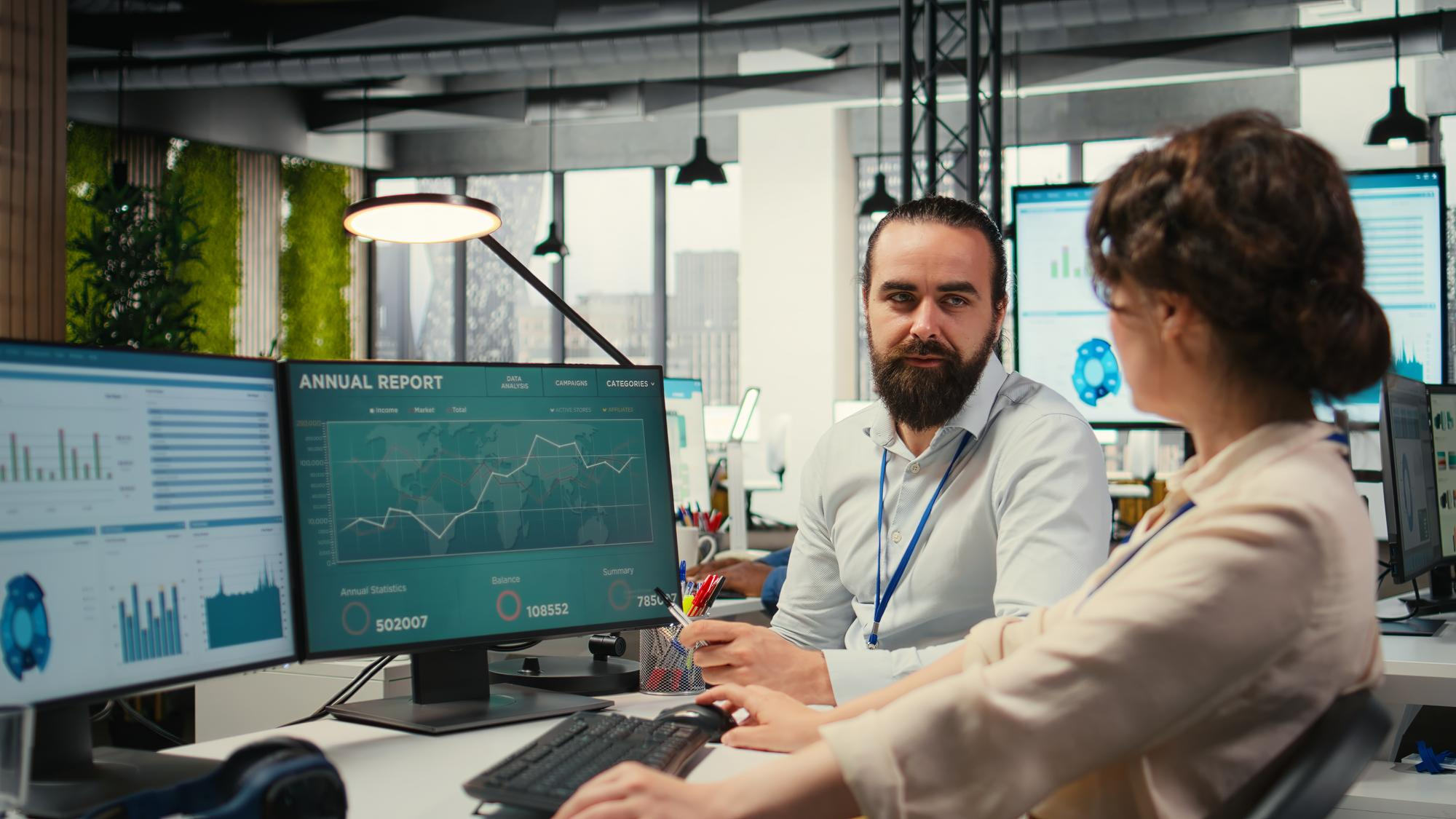 Professionals analyzing financial reports in a modern office